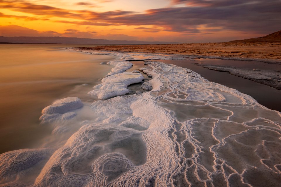 Body Of Water During Sunset