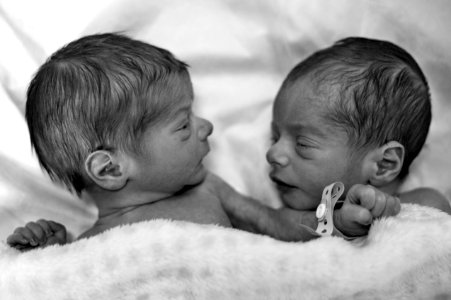 Grayscale Photography Of Two Newborn photo