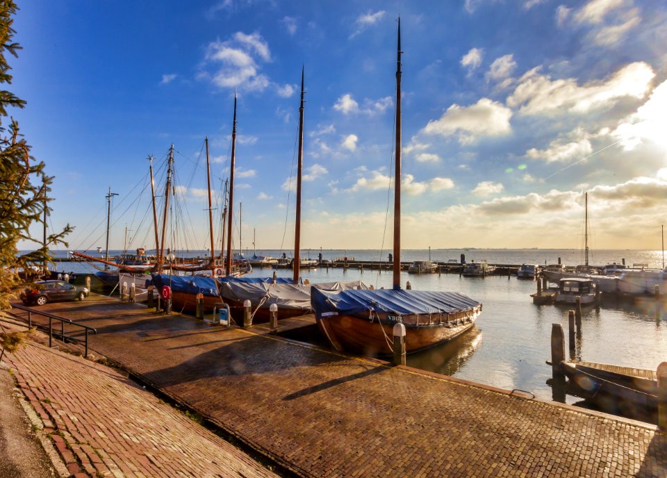 Boats Near Dock Under Gray Sky