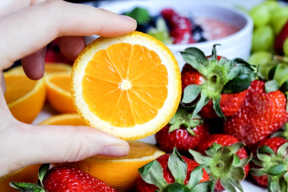 Slice Orange Fruit And Strawberries