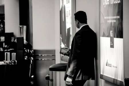 Man In Suit Jacket Near Poster photo