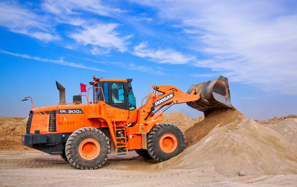 Orange Excavator On Brown Hill