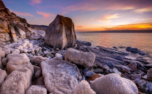 Gray Rock Formation On Seaside At Golden Hour photo