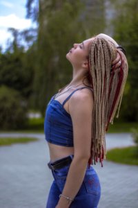Woman Facing Left Side While Right Hand Holding Hair
