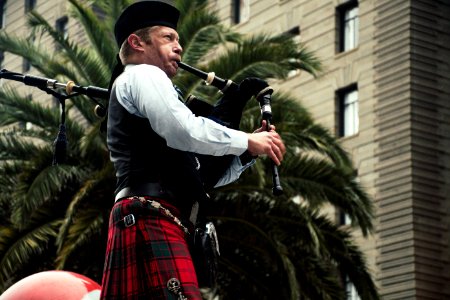 Men Playing Wind Instrument