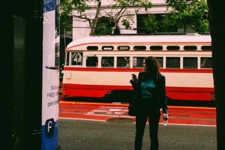 Woman Wearing Black Blazer Beside White And Red Cable Cab