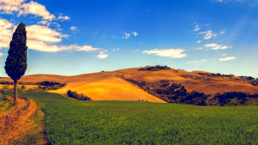 Green Grass And Mountain Under Blue Sky photo