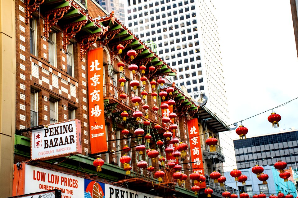 Red Chinese Paper Lanterns Hanged Near Buildings photo