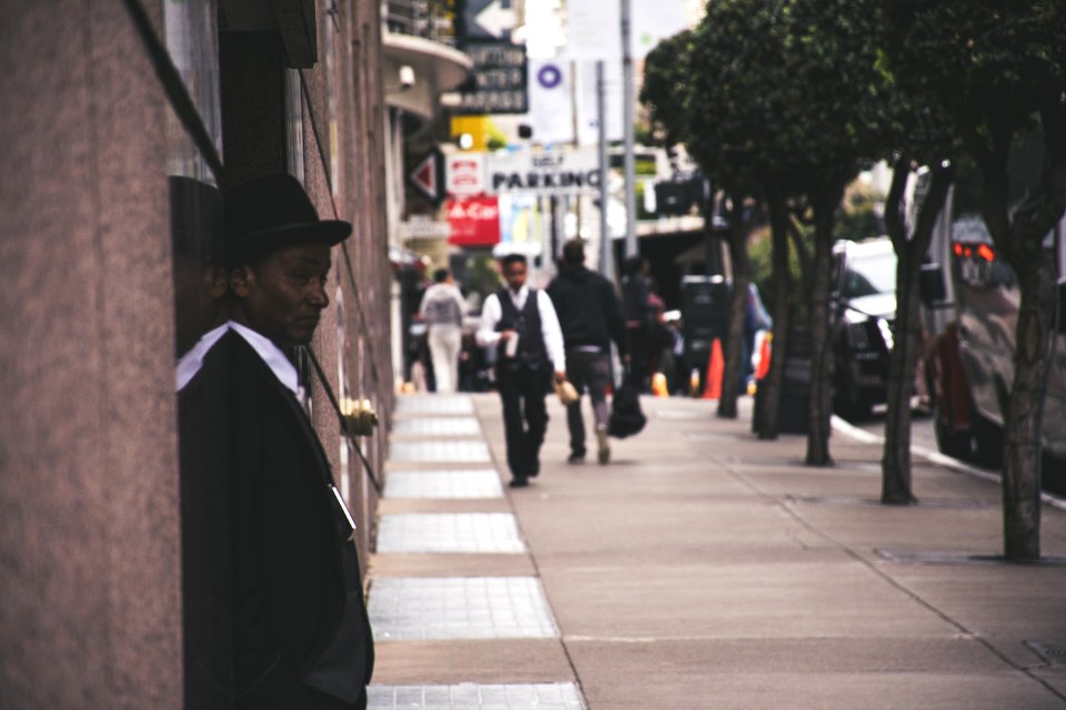 Man Wearing Black Blazer Beside Building