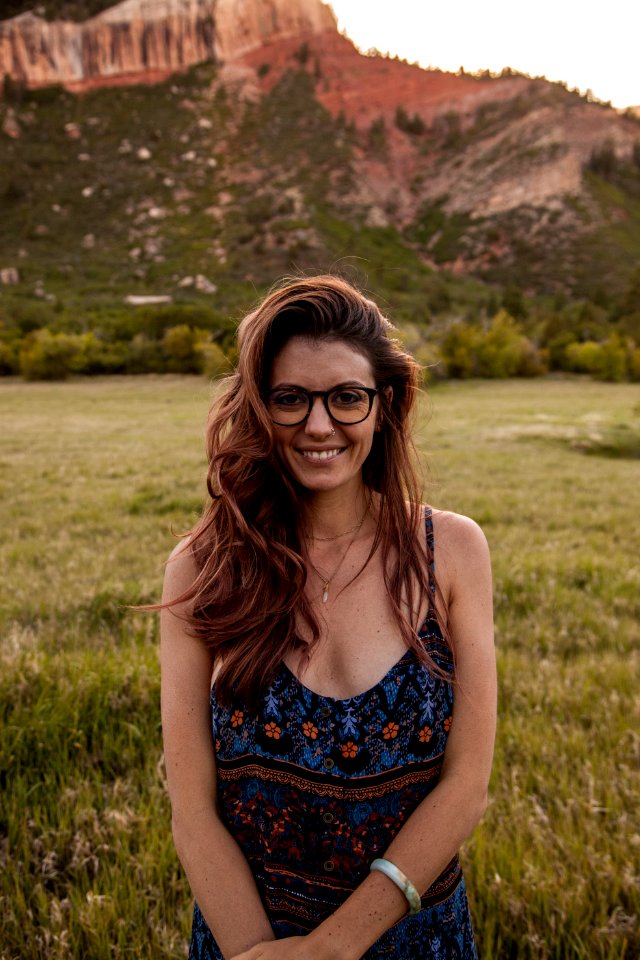 Woman Wearing Multicolored Spaghetti Strap Dress Standing Near Green Grass At Daytime