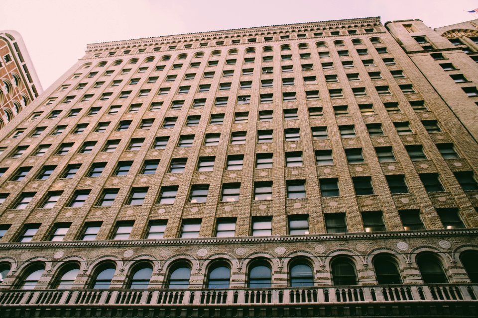 Low Angle Photography Of Brown Building photo