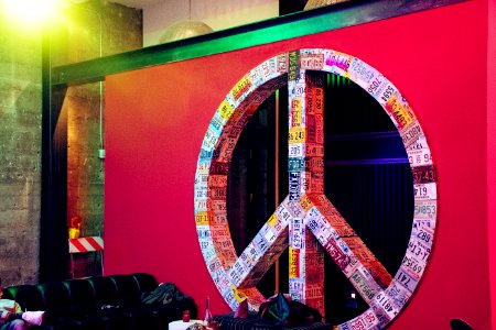 Red And Multicolored License Plate Covered Peace Sign Wall Decor