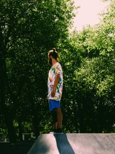 Man Wearing White And Multicolored Floral Standing Near Trees photo