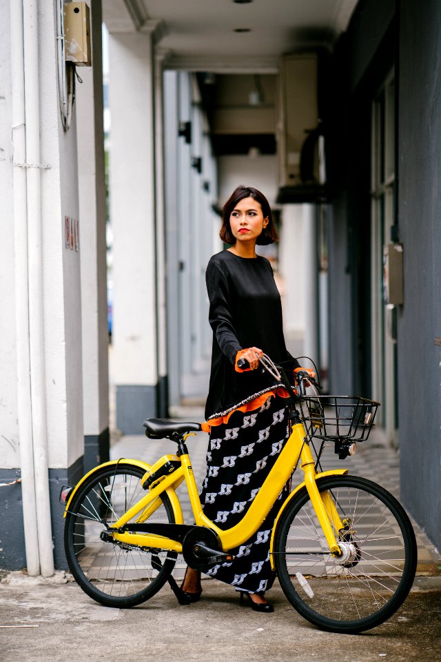 Woman Holding Yellow Bike At Daytime