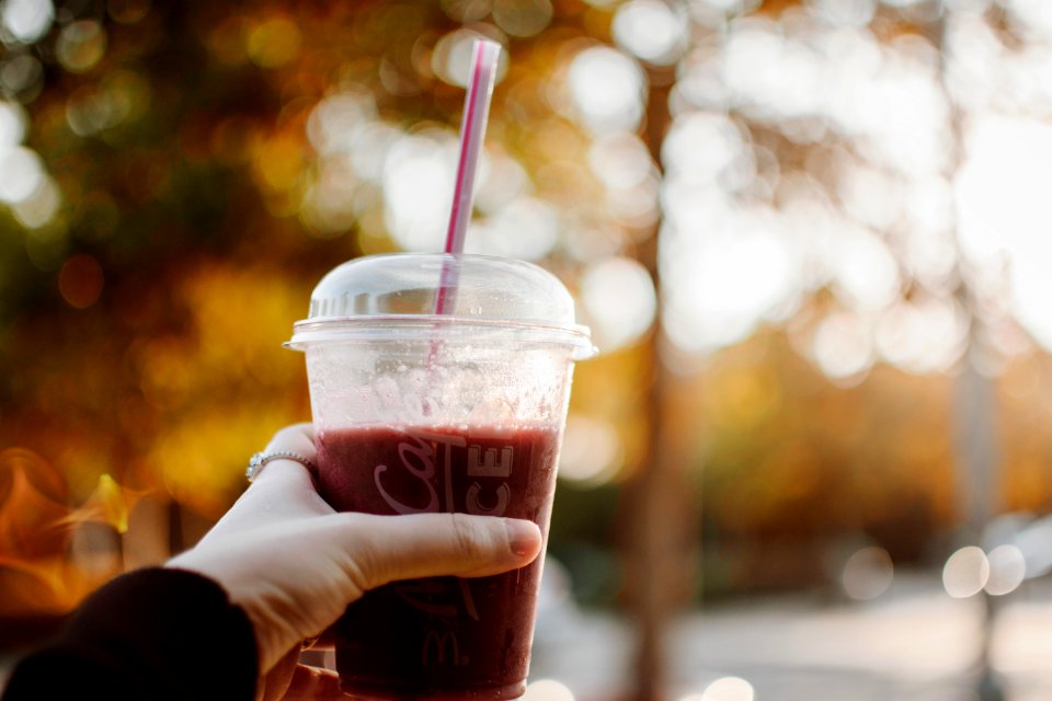 Person Holding Plastic Cup photo