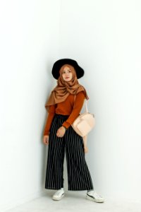 Woman In Brown Long-sleeved Shirt And Brown Hijab Headdress With Beige Leather Backpack