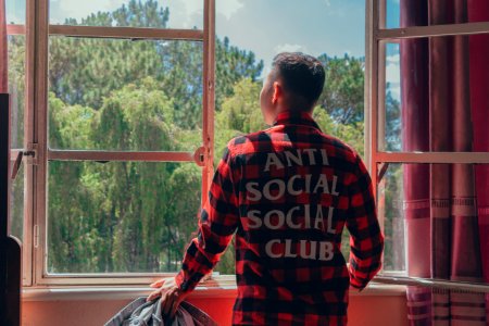 Man Looking Outside Window