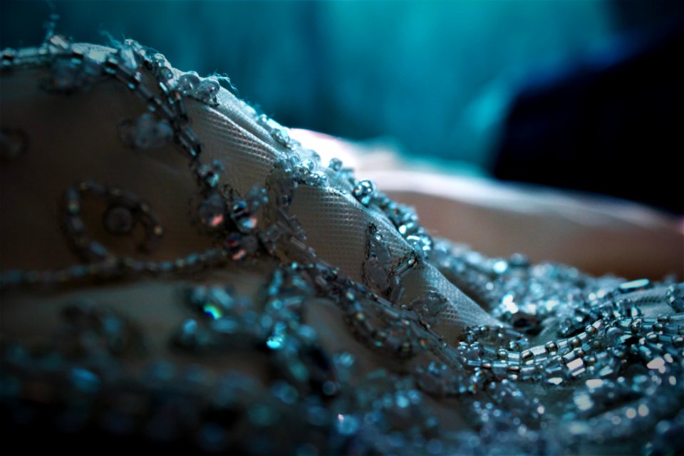 Selective Focus Photo Of Beaded Gray Textile
