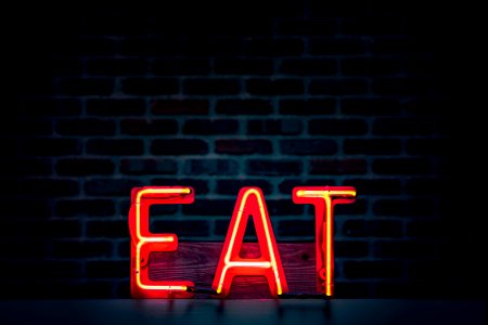 Red Eat Neon Sign Turned On