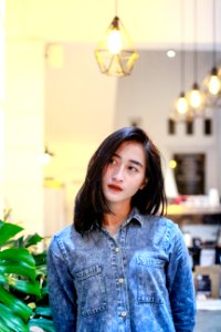 Woman In Blue Denim Button-up Jacket photo