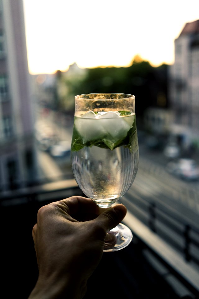Person Holding Clear Wine Glass