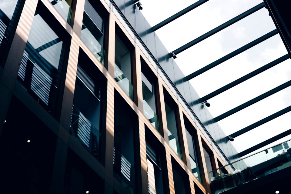Low-angle Photography Of Gray And Black Concrete Building