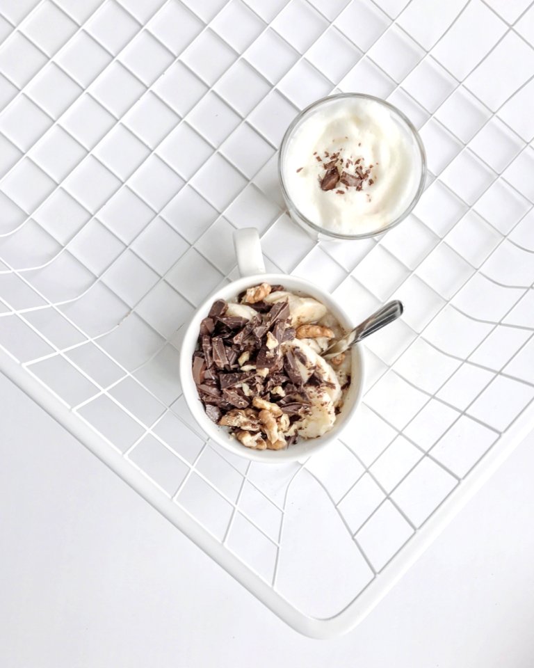 Crushed Nuts And Chocolates On White Ceramic Mug High-angle Photography
