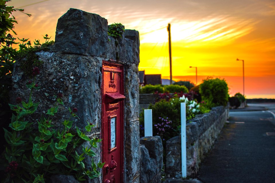 Gray Concrete Wall With Red Metal Door photo