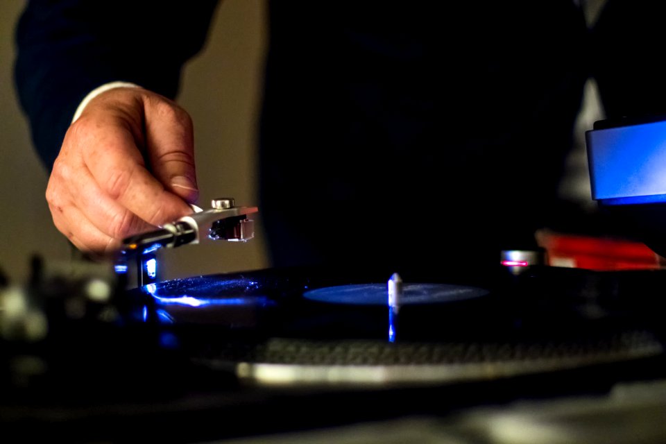 Person Holding Vinyl Player In Shallow Focus Photography