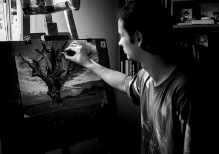 Grayscale Photography Of Man Painting A Tree