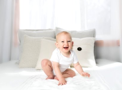Laughing Baby Wearing White Shirt