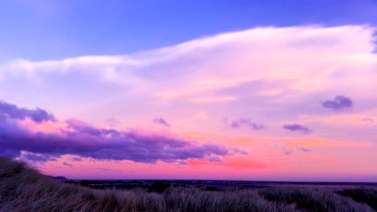 Photo Of A Nimbus Clouds During Sunset photo