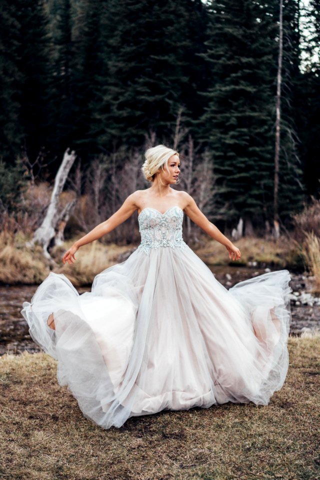 Woman Wearing White Sweetheart-neckline Dress Standing Near Green Leaf Trees