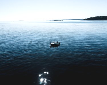 Two Person Riding Boat