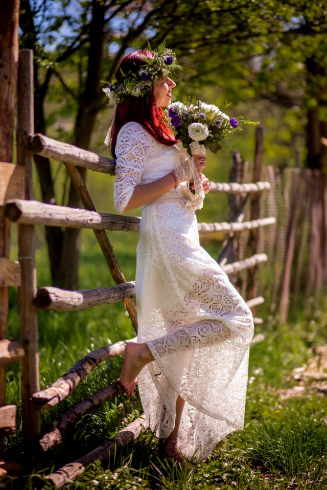 Woman In White Long-sleeved Gown Holding Flower Bouquet