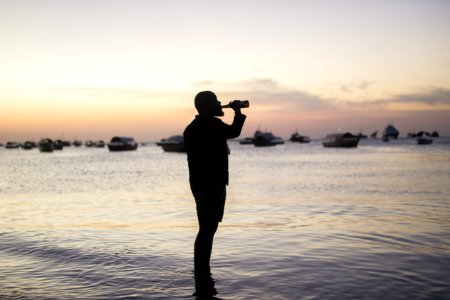 Silhouette Photo Of Man Drinking