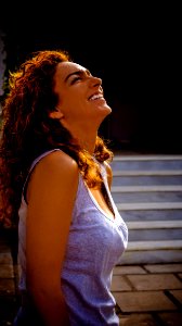 Smiling Woman Wearing Sleeveless Top photo