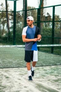 Man Wearing Blue And White Crew-neck Shirt And Shorts photo