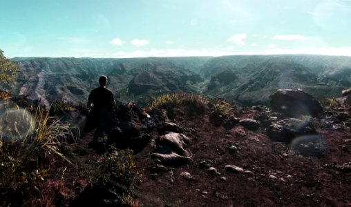 Person Standing Near Cliff photo