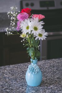 Assorted Flowers In Blue Vase photo