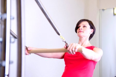 Short Black-haired Woman In Red Sleeveless Top photo