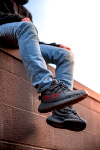 Person Wearing Adidas Yeezy Boost Shoes photo