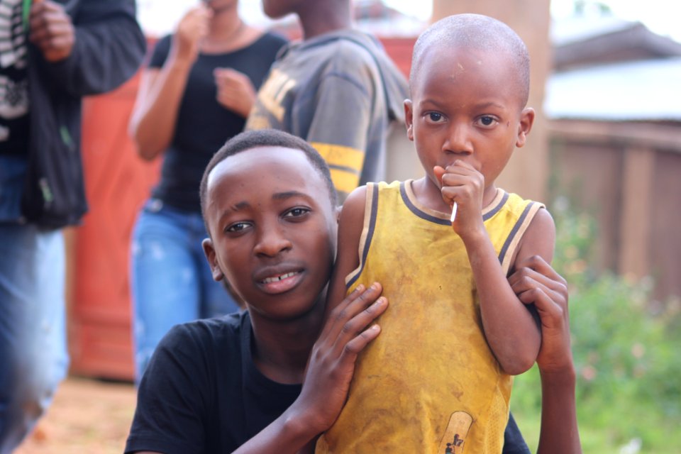 Man And Boy Wearing Black And Yellow Shirts