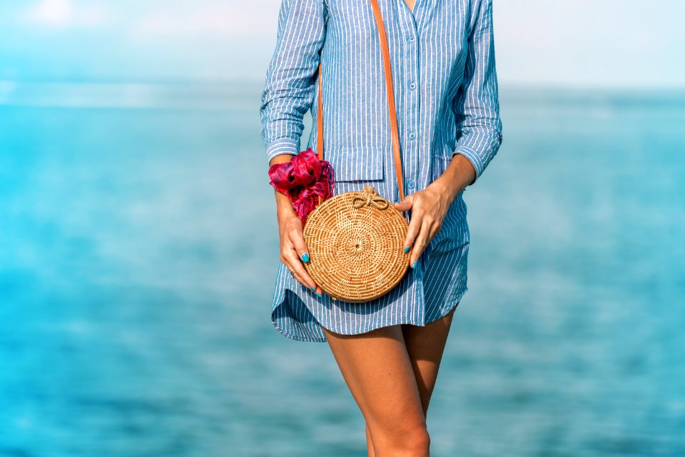 Woman Wearing Blue Long-sleeved Button-up Dress And Brown Sling Bag