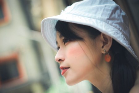 Selective Focus Photo Of Woman Wearing White Cap photo