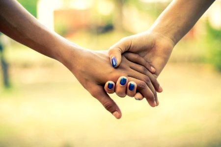 Two People Holding Hands