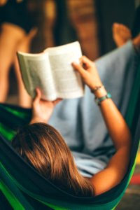 Woman On Hammock Reading Book photo