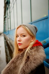 Photo Of Woman Standing Beside Truck