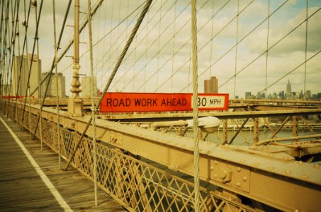 Red And White Signage With Road Work Ahead Text