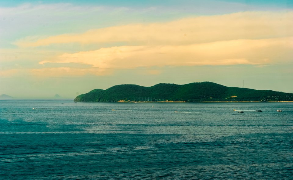 Body Of Water With Background Of Mountain During Golden Hour